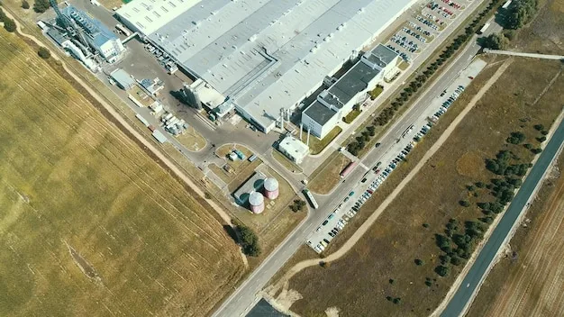 Modern industrial park with large warehouses and trucks, conveying the concept of nearshoring and logistics infrastructure.