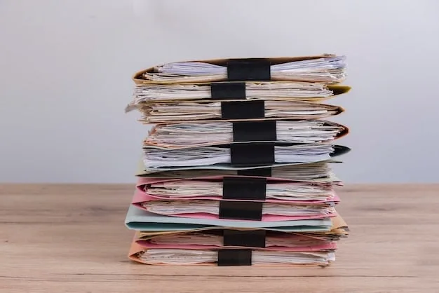 A stack of neatly organized documents, including tax forms, utility bills, and bank statements, on a wooden desk with a