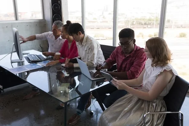 A diverse group of employees in a modern office setup in Mexico, engaged in a discussion, symbolizing the importance of internal HR and team management post-labor reforms.