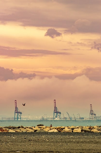 Industrial landscape with oil rigs and solar panels juxtaposed, representing the diverse and often conflicting energy interests in Mexico, with a subtle emphasis on US corporate logos, implying their presence.