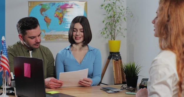 A legal professional explaining visa application forms to a Mexican couple in an office setting, highlighting diligence and compliance.