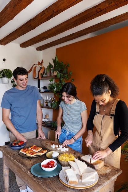 A group of American tourists participating in an eco-friendly cooking class in a rural Mexican setting, learning about local ingredients and traditional preparation methods, emphasizing sustainable and immersive travel.